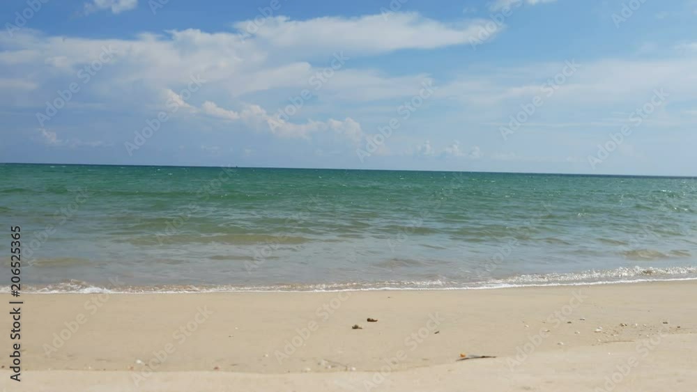 Beautiful sand beach with soft wave in sea water , cloudy blue sky sunny day Beautiful sand beach with soft wave in sea water , cloudy blue sky sunny day