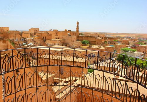 Midyat, Turkey - Midyat old town view. The ancient city of Midyat is located in southeast Turkey and has managed to preserve the old buildings and churches. photo