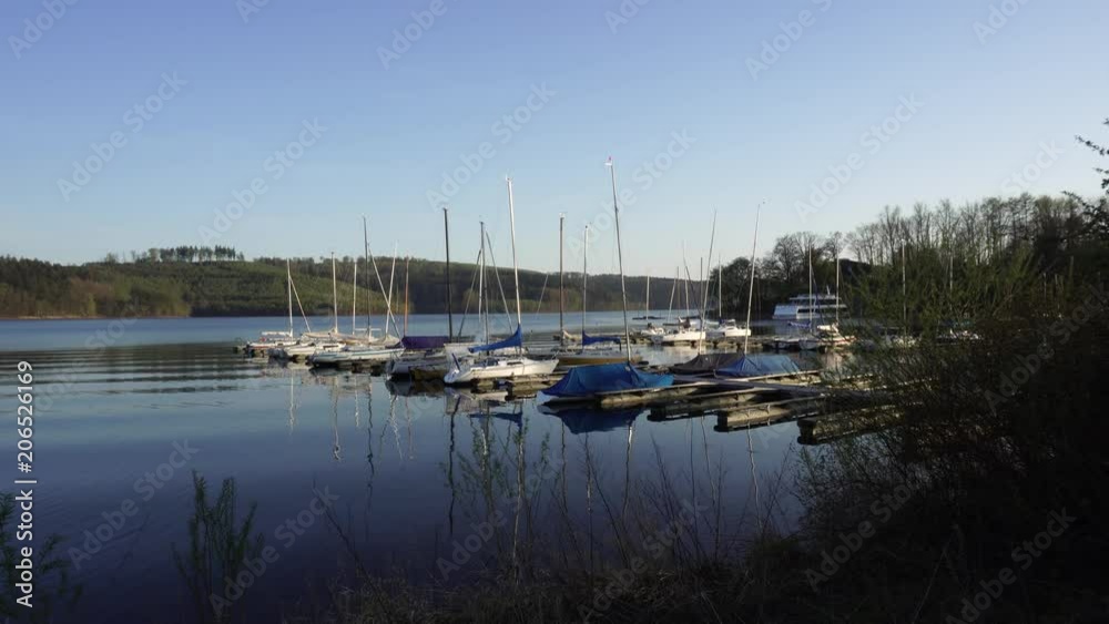 White Boats Yachts On Pier Harbor, Sorpesee Lake, Germany White Boats Yachts On Pier Harbor, Sorpesee Lake, Germany