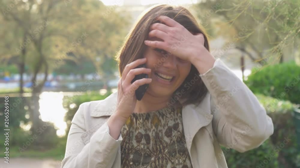 Beautiful happy woman at sunset talking on the phone Beautiful happy woman at sunset talking on the phone