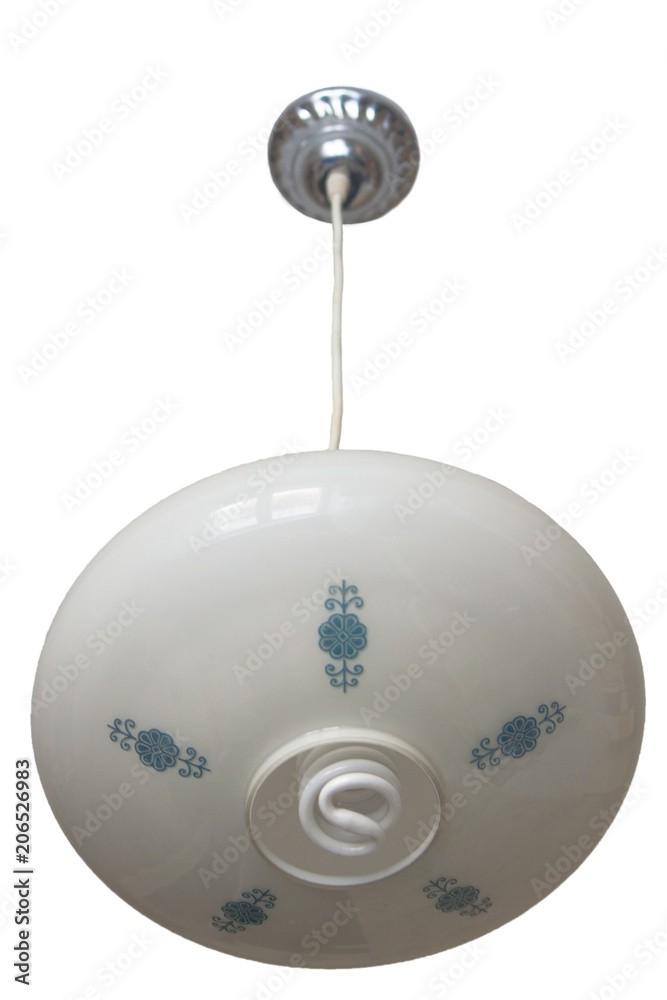 An old Soviet lamp hangs on the ceiling. It is white with a blue pattern in the form of flowers. It is screwed with an energy-saving lamp...