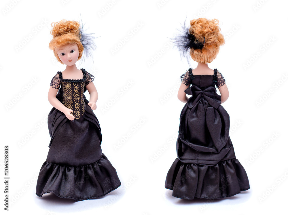 Porcelain doll with red hair in a long black vintage dress, front and back view