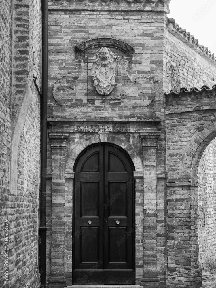 University Entrance with written on the door: Free University of Urbino, Faculty of Law.