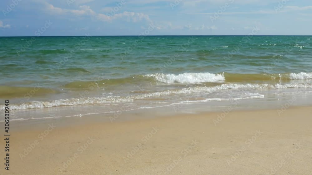Beautiful sand beach with soft wave in sea water , cloudy blue sky sunny day Beautiful sand beach with soft wave in sea water , cloudy blue sky sunny day