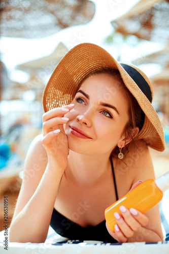 Suntan Lotion Woman Applying Sunscreen Solar Cream. Skincare