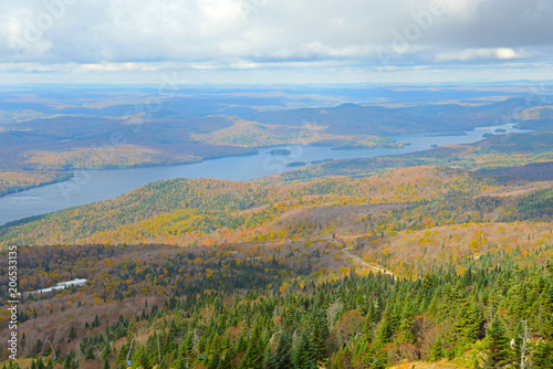 Lake Tremblant and Mont-Tremblant village in fall with fall foliage  from top of Mont Tremblant  Quebec  Canada.