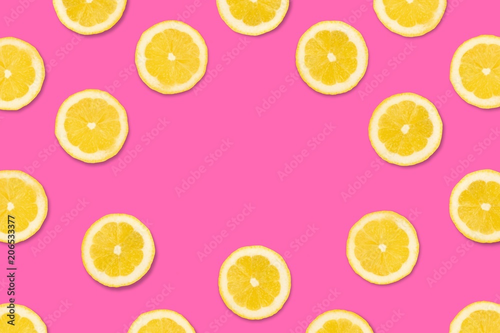 Colorful fruit frame, Lemon slices on a pastel pink background. Top view with copy space.