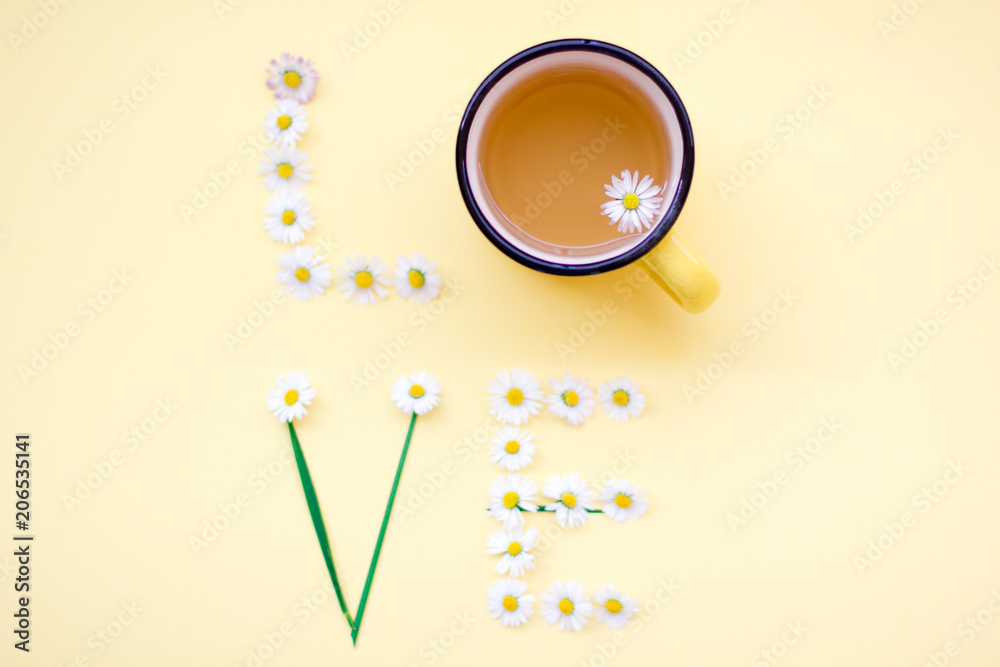 Love message written with flowers on yellow background. Individual Love concept. Love message written with flowers on yellow background. Individual Love concept.