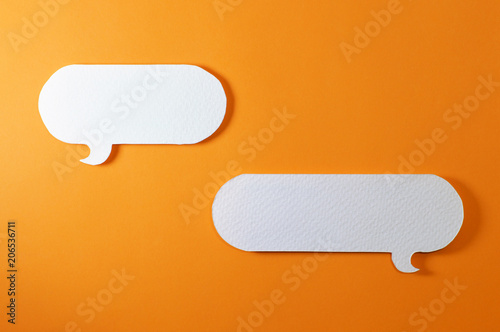 couple of rounded text bubble on orange background