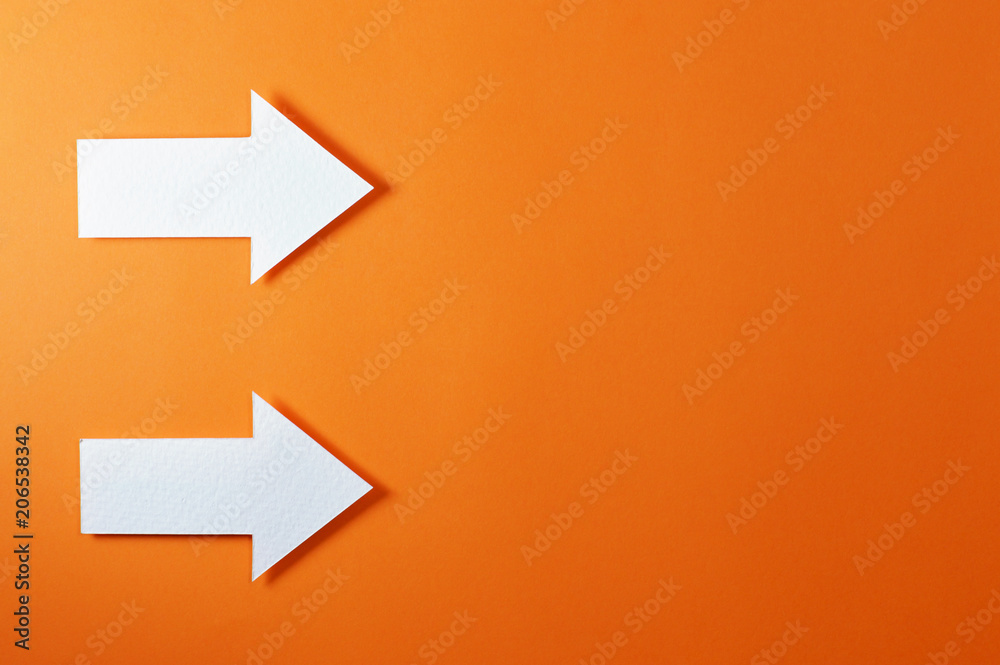 two solid arrows on orange background two solid arrows on orange background