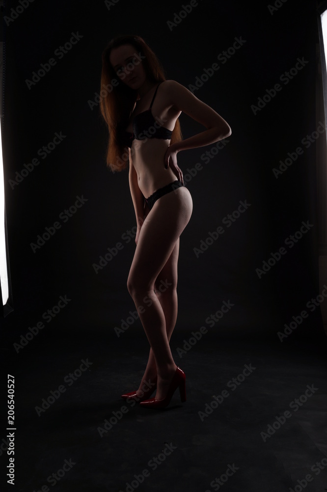 Perfect woman body on black background - obrazy, fototapety, plakaty 