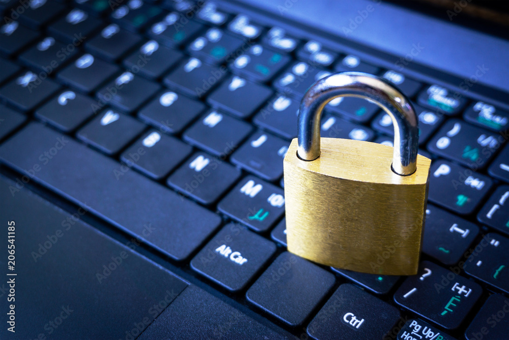 Golden Padlock on Keyboard Cyber Security Concept With Copy Space Golden Padlock on Keyboard Cyber Security Concept With Copy Space