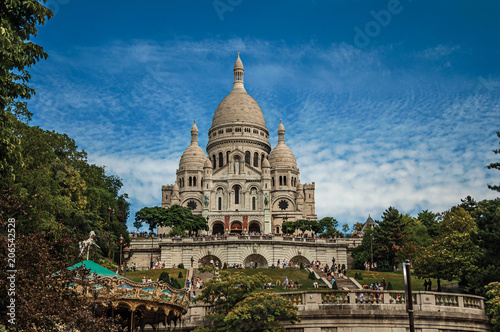 Staircase, domes and facade of the Basilica of Sacre Coeur at the Montmartre district in Paris. Known as the “City of Light”, is one of the most impressive world’s cultural center. Northern France. © Celli07
