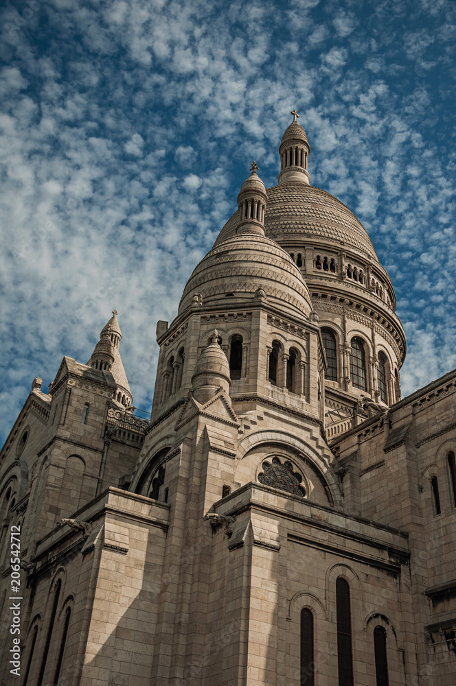 Close-up of domes and decoration at the Basilica of Sacre Coeur facade in Paris. Known as the “City of Light”, is one of the most impressive world’s cultural center. Northern France.