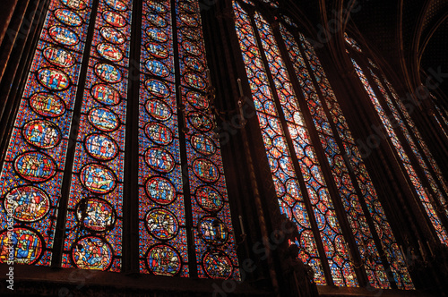 Colorful stained glass windows at the gothic Sainte-Chapelle (church) in Paris. Known as the “City of Light”, is one of the most awesome world’s cultural center. Northern France.