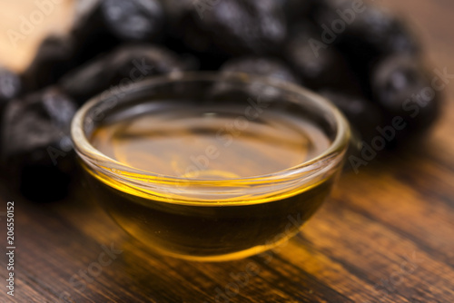 Close up of black olives and olive oil