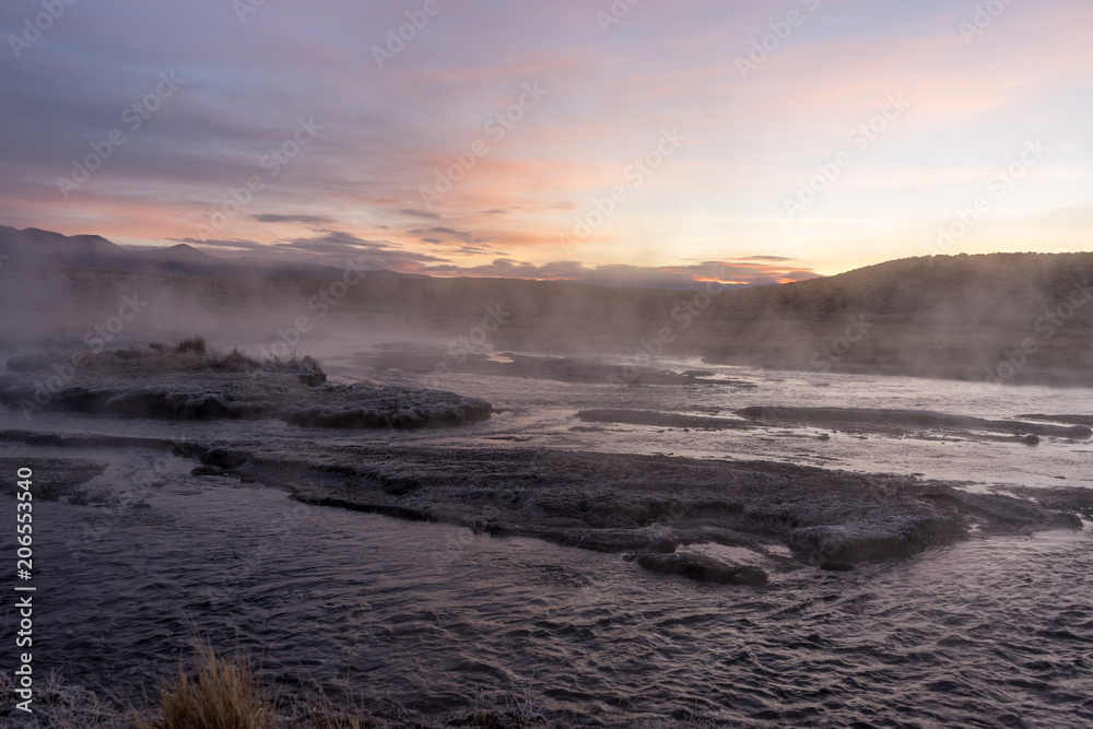 Off the beaten path watching a sunrise over a steaming river of geothermal water