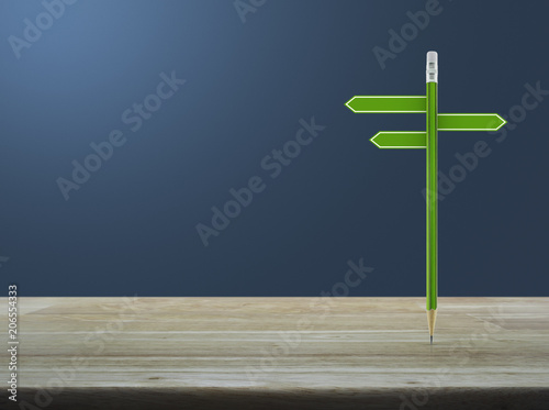 Green pencil with blank sign plate on wooden table over light blue gradient background, Business presentation concept