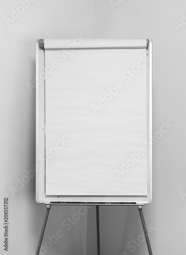 Tableau sur toile Bulk white flipchart over a white corner wall, ideal for mockup and presentation