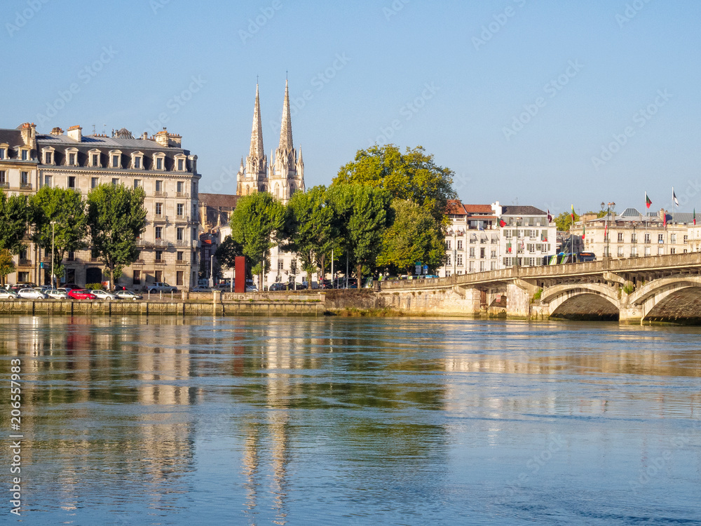 Obraz premium Adour River and the spires of the Cathedral of Saint Mary - Bayonne, France