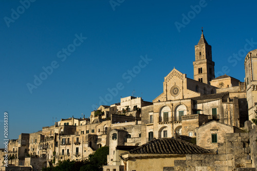 Horizontal View of the City of Matera at Sunset on Clear Blue Sky Background