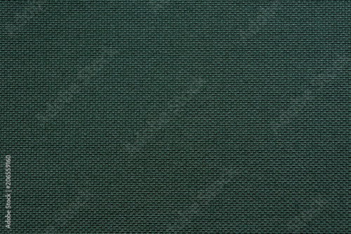 texture of dense dark green fabric closeup photo