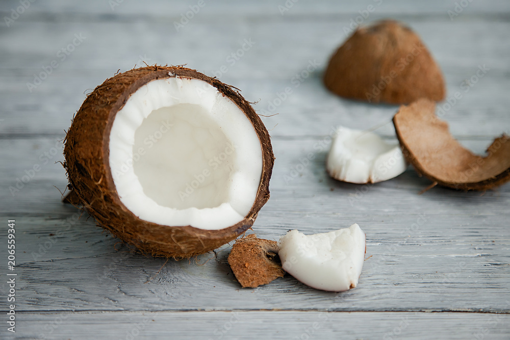 Fresh organic coconut on rustic wooden background Fresh organic coconut on rustic wooden background
