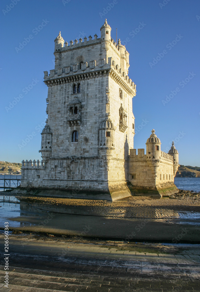 Tower of St Vincent (Torre de Belem), with river Tagus in background in afternoon sun light. Lisbon, Portugal