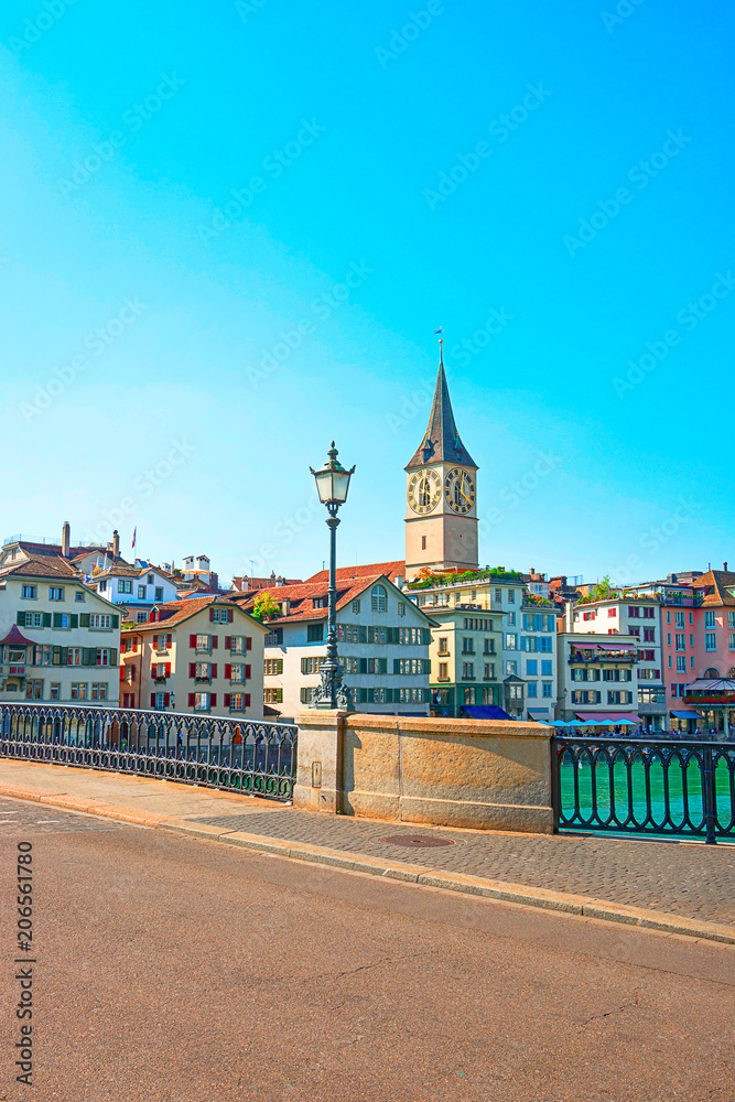 Naklejka premium Limmat quay with St Peter clock tower Zurich