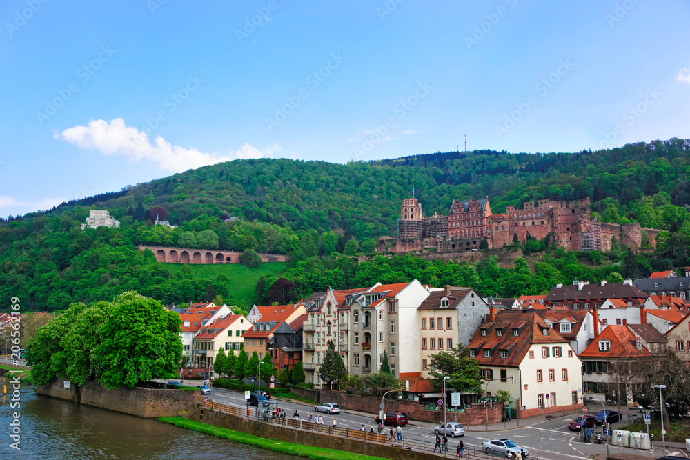 Quay of Neckar River and city view of summer Heidelberg