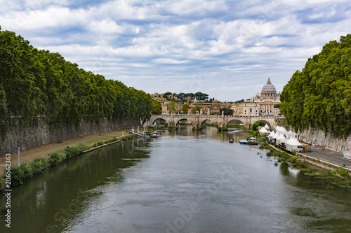 View of Tiber river with Saint Peter's Dome at distance in Rome, Italy
