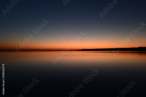 Twilight sky above the water surface of the lake
