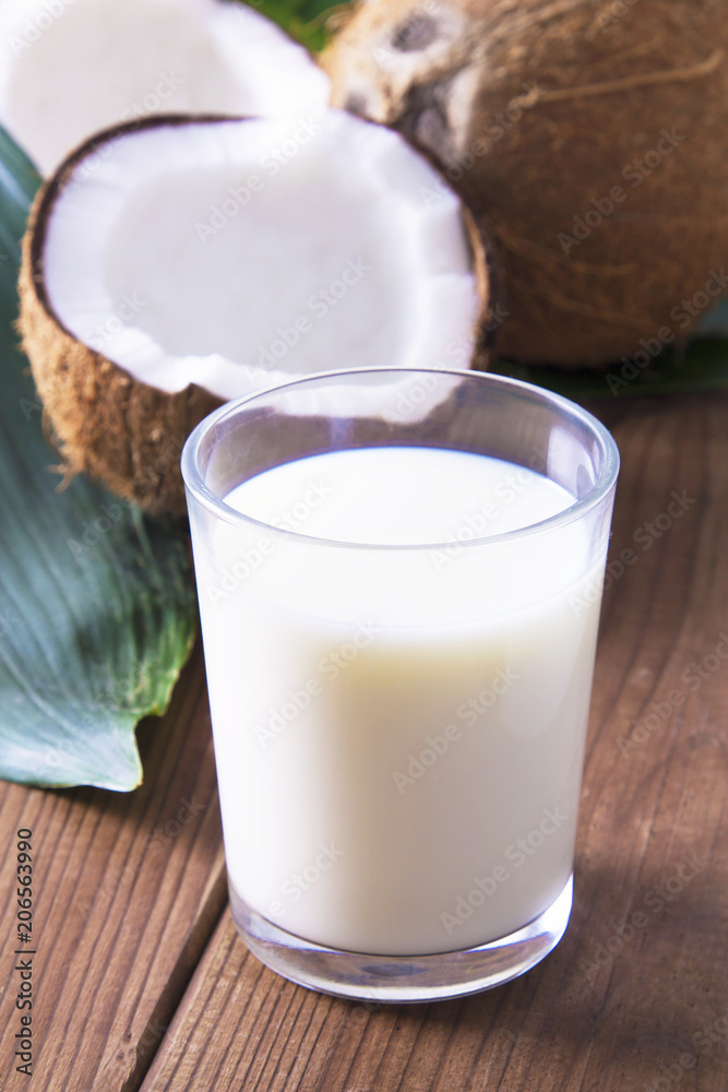 glass of coconut milk with wooden background glass of coconut milk with wooden background