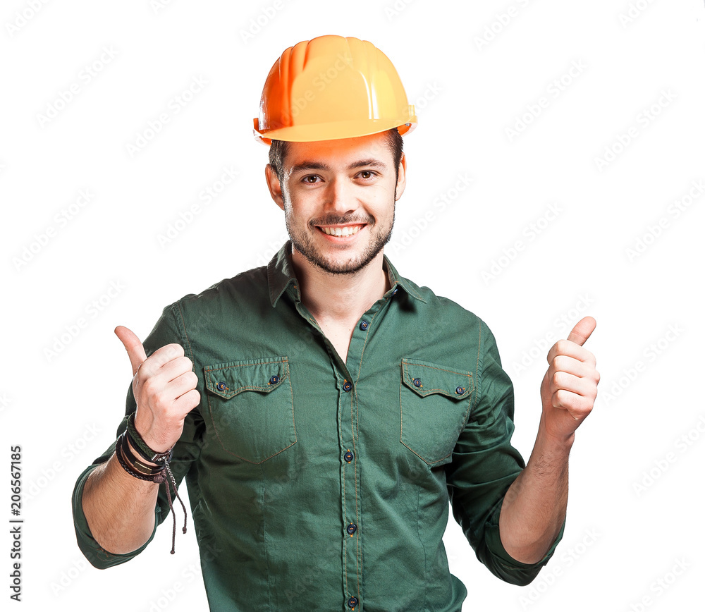 Young construction workers in hard hats Young construction workers in hard hats