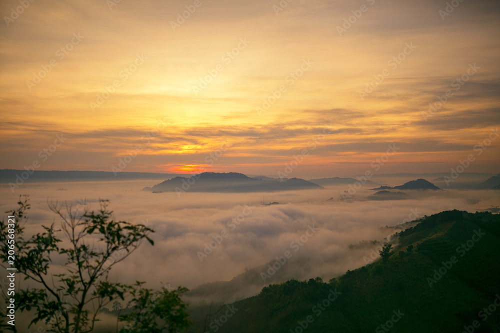 Landscape mist at the dawn of a high mountain pass to the Mekong river the between Thai - Laos.