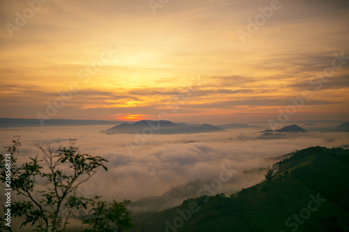 Landscape mist at the dawn of a high mountain pass to the Mekong river the between Thai - Laos.