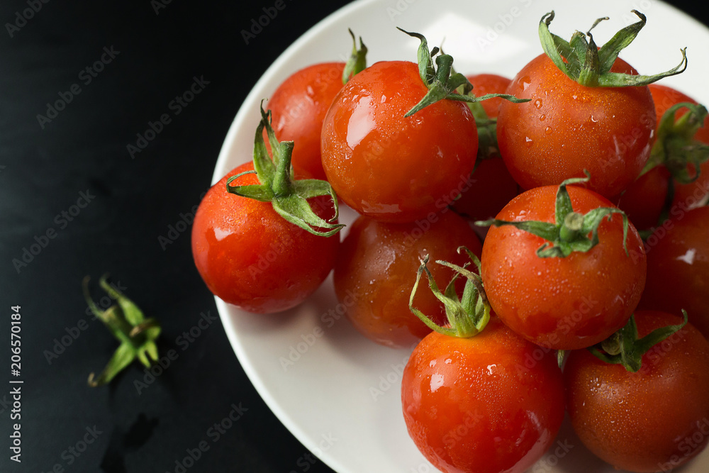 close up fresh tomato on black table background. close up fresh tomato on black table background.
