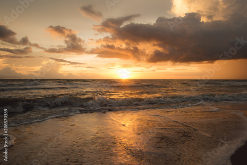 Fototapeta Naklejka Na Ścianę i Meble -  Sunset on the beach with beautiful sky . Sunrise on the beach .