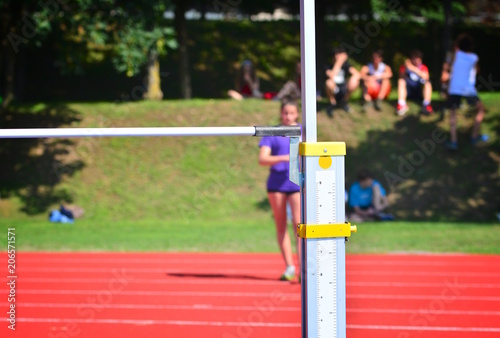 Athlete in action of high jump; successful concept.