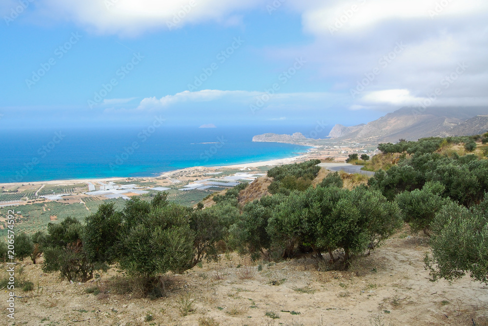 Landscape with trees, coast and blue sea,  in Crete, Greece.