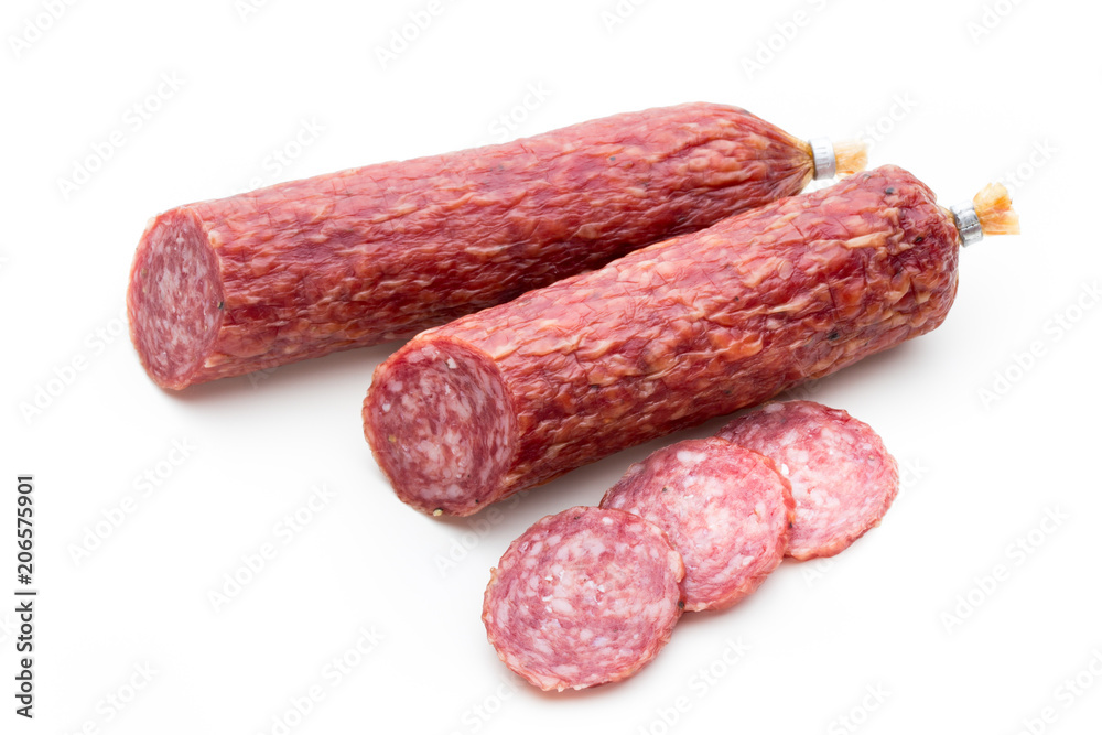 Salami smoked sausage, basil leaves and peppercorns isolated on white background.