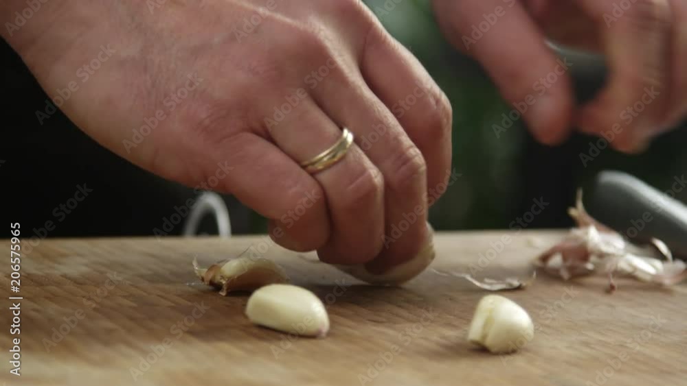 Chef peeling garlic Chef peeling garlic