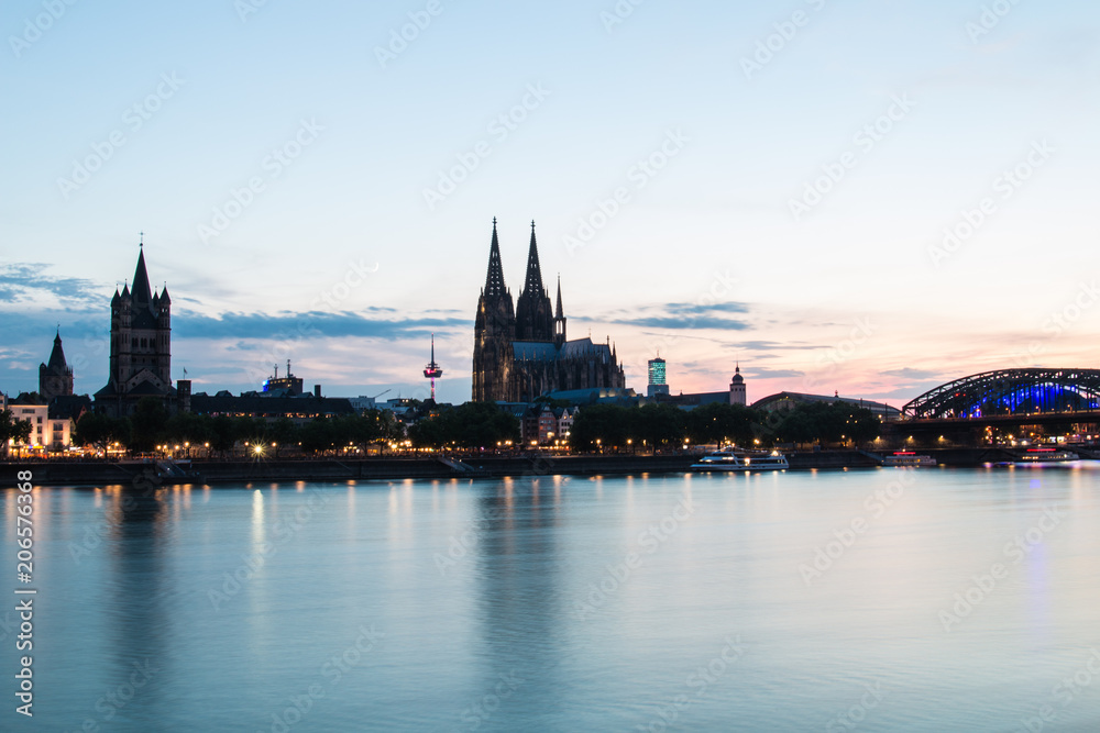 Cologne Cathedral reflecting in River Rhine at Sunset Cologne Cathedral reflecting in River Rhine at Sunset