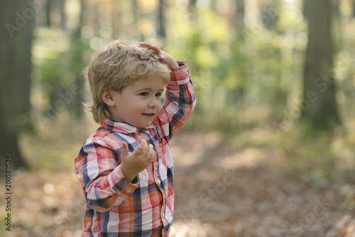 Child portrait smiling. Portrait of child. Funny little boy on nature background. Adorable young happy boy with smile. Happy joyful beautiful little boy. Cute baby in shirt