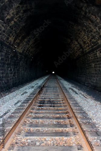 Longest dark railway tunnel soft focus. The length of the tunnel is 778 meters located on the Polovinnaya (Half) Station of the Circum-Baikal Railway. View of the light at the end of the tunnel