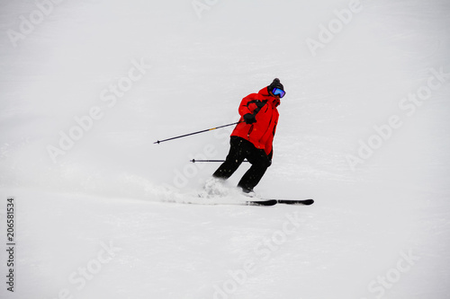 The skier descends the slalom from the mountain