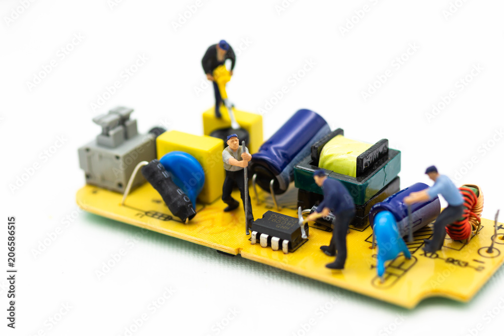 Miniature worker repairing mainboard, clear virus computer and repair, security and technology concept.