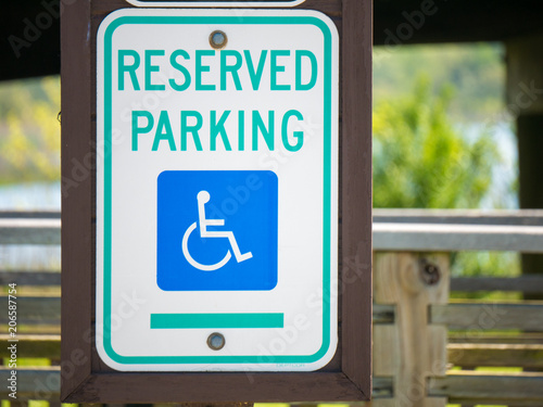 Disabled parking space sign sign on a pole photo