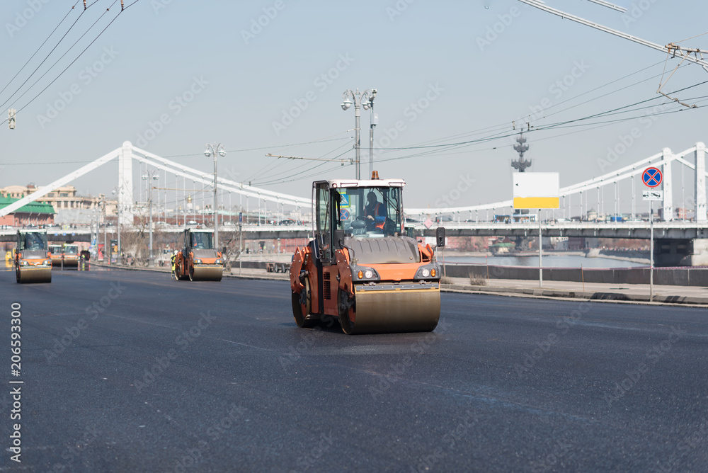 Russia, moscow, Frunzenskaya naberezhnaya. Road Construction with a lot of heavy machines and workers. Very fast work