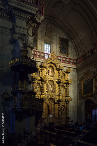 Altarpiece lightened by a beam of sunshine in the baroque church of the Society of Jesus, Arequipa 